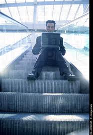 man on escalator